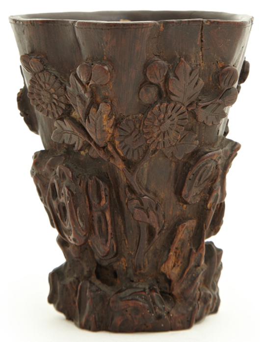 Highly collectible Chinese carved rhinoceros horn libation cup, one of three such cups to be sold. Crescent City Auction Gallery image.